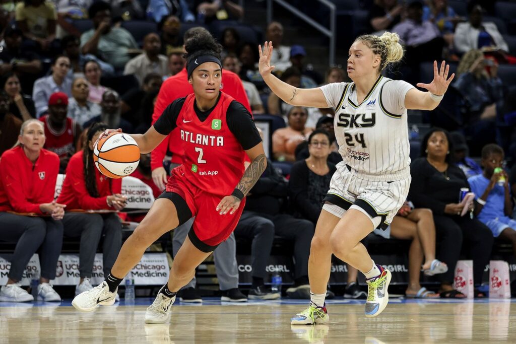 A WNBA game halted as a sex toy flies from the stands onto the court, leading to player concern and league backlash.
